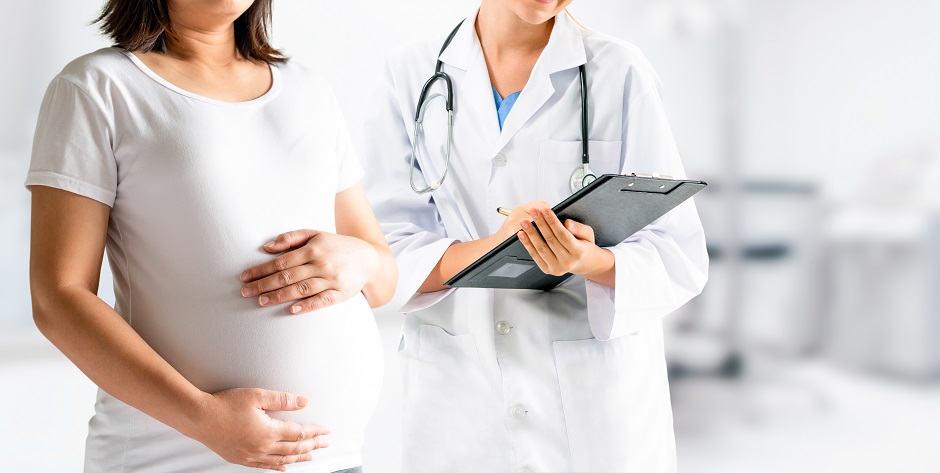 Pregnant Woman and Gynecologist Doctor at Hospital