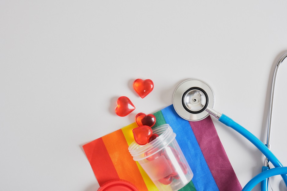 hearts in a test jar, stethoscope and lgbtq flag, sperm and egg donation for gay couples